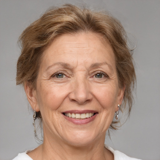 Joyful white middle-aged female with medium  brown hair and brown eyes