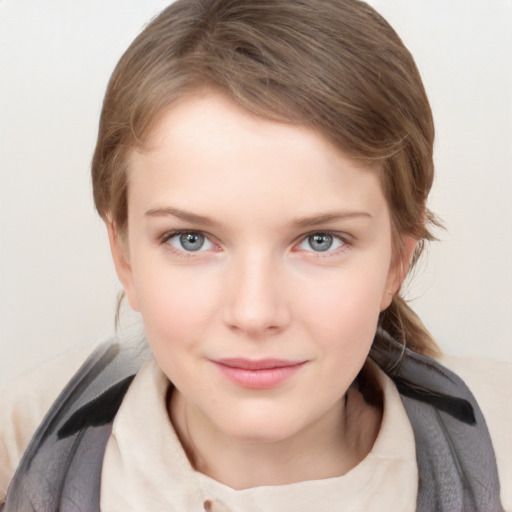 Joyful white young-adult female with medium  brown hair and blue eyes