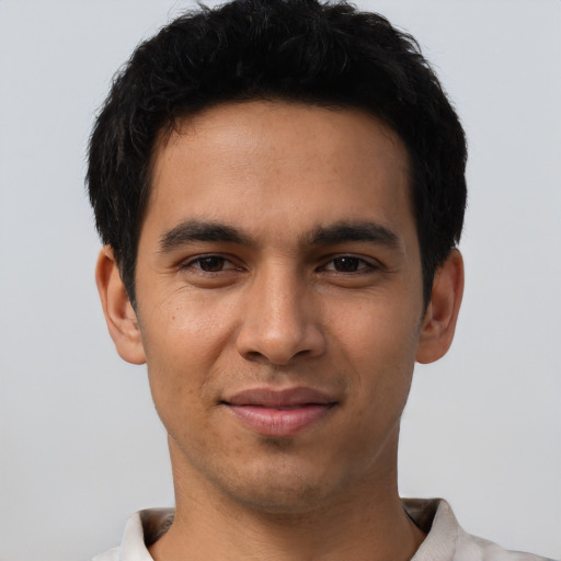 Joyful asian young-adult male with short  black hair and brown eyes