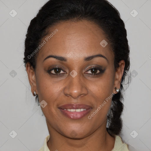 Joyful black adult female with short  black hair and brown eyes