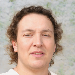 Joyful white adult male with medium  brown hair and brown eyes