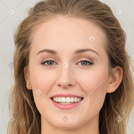 Joyful white young-adult female with long  brown hair and grey eyes