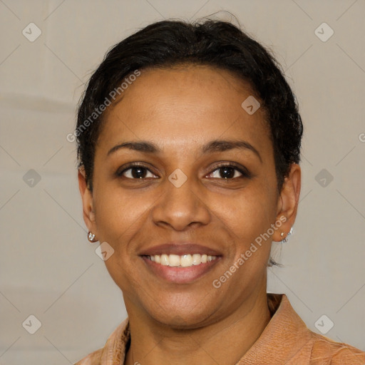 Joyful black young-adult female with short  black hair and brown eyes