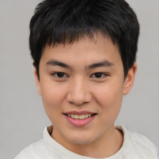 Joyful white child male with short  brown hair and brown eyes