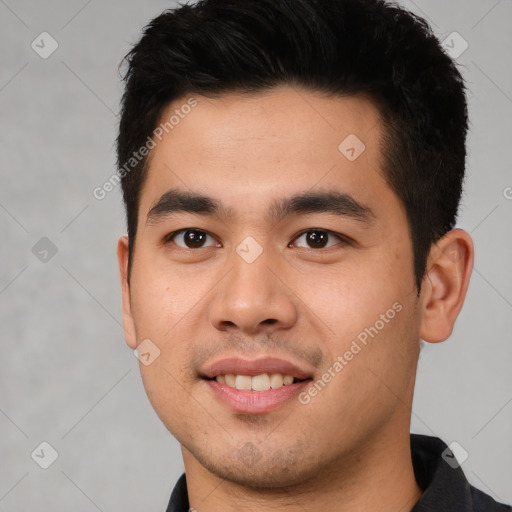 Joyful latino young-adult male with short  black hair and brown eyes