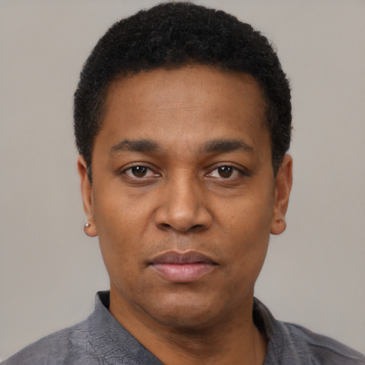 Neutral black young-adult male with short  black hair and brown eyes