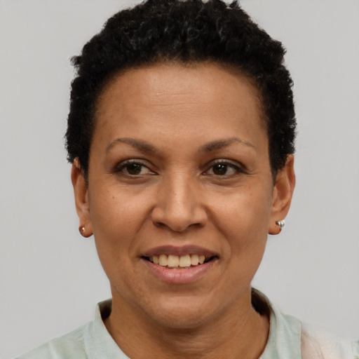 Joyful latino adult female with short  brown hair and brown eyes