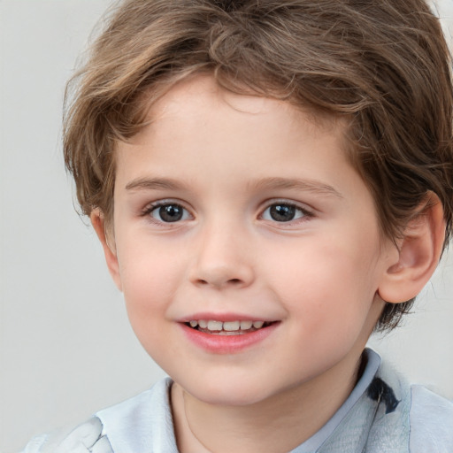 Joyful white child male with short  brown hair and brown eyes