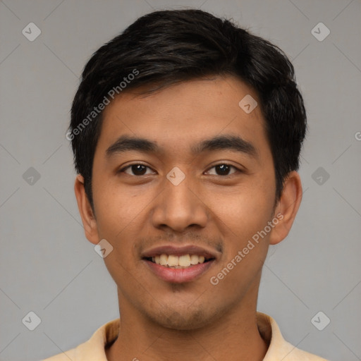 Joyful latino young-adult male with short  black hair and brown eyes