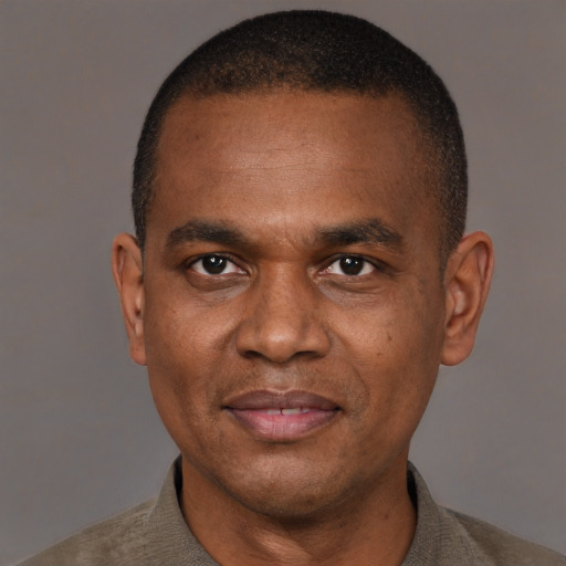 Neutral latino adult male with short  brown hair and brown eyes