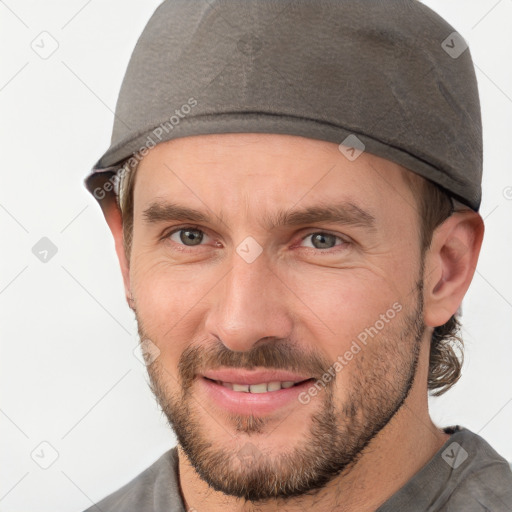 Joyful white adult male with short  brown hair and brown eyes