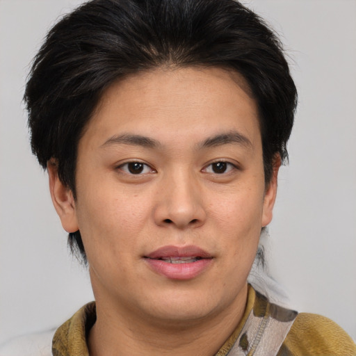 Joyful asian young-adult female with short  brown hair and brown eyes