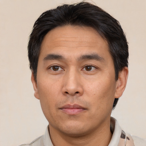 Neutral asian adult male with short  brown hair and brown eyes