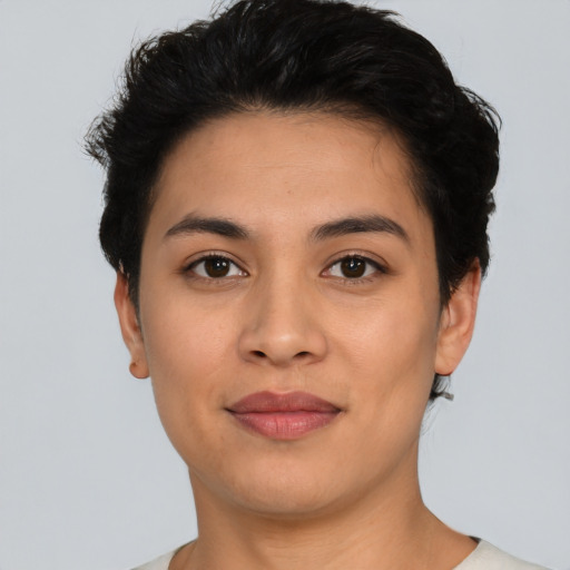 Joyful asian young-adult female with short  black hair and brown eyes