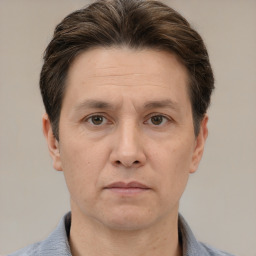 Neutral white adult male with short  brown hair and brown eyes