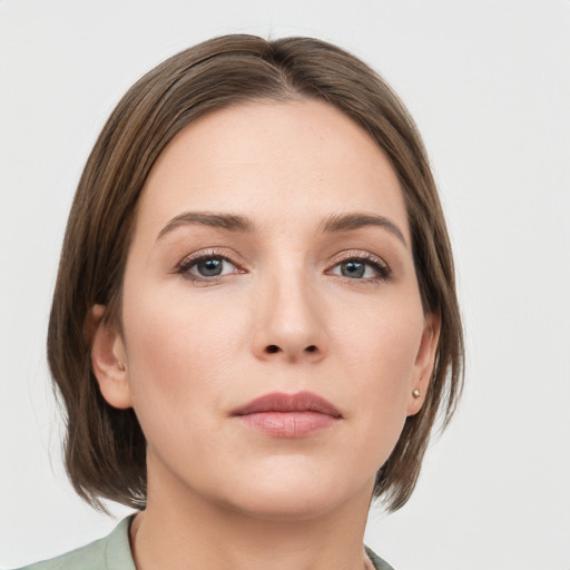 Neutral white young-adult female with medium  brown hair and grey eyes