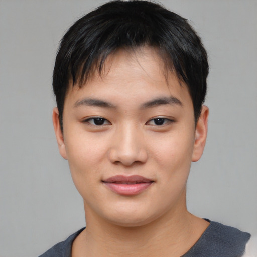 Joyful asian young-adult male with short  brown hair and brown eyes
