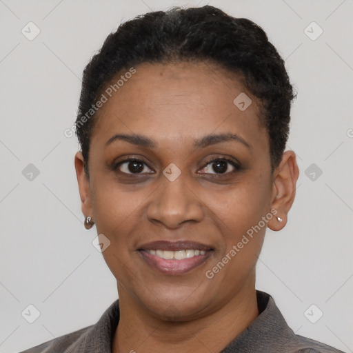 Joyful black young-adult female with short  black hair and brown eyes