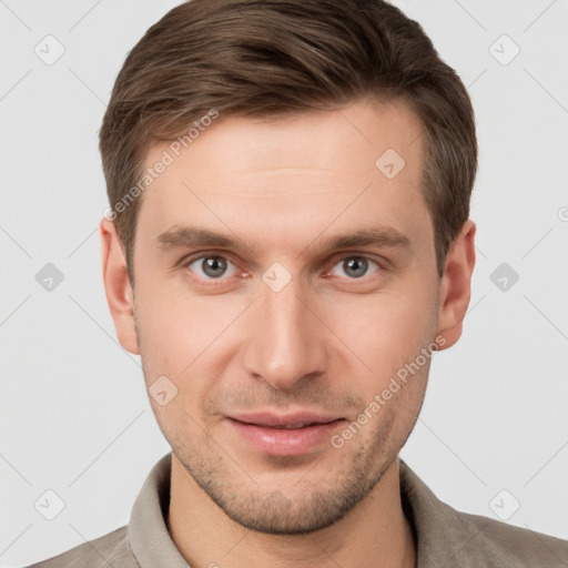 Joyful white young-adult male with short  brown hair and grey eyes