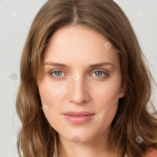 Joyful white young-adult female with long  brown hair and green eyes