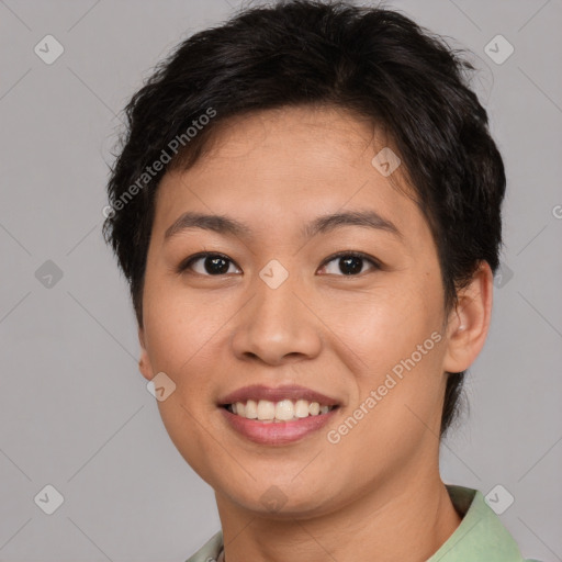 Joyful asian young-adult female with short  brown hair and brown eyes