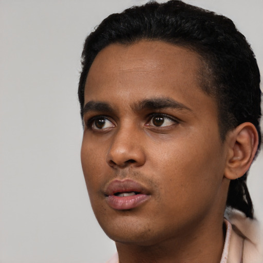 Neutral black young-adult male with short  black hair and brown eyes