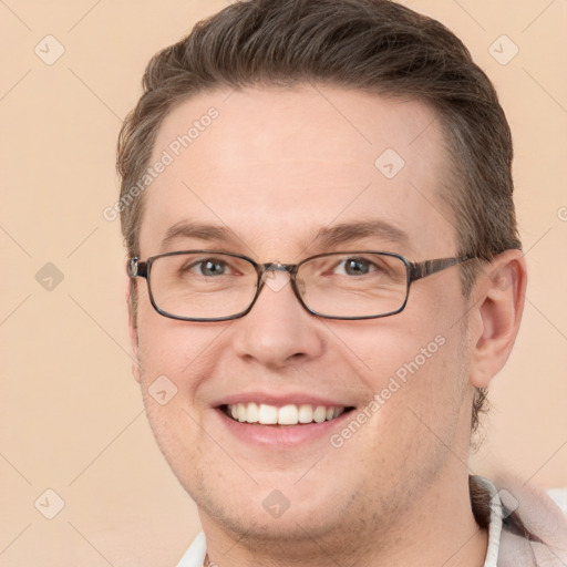 Joyful white adult male with short  brown hair and grey eyes