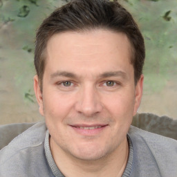 Joyful white adult male with short  brown hair and brown eyes