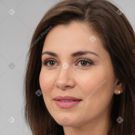 Joyful white young-adult female with long  brown hair and brown eyes