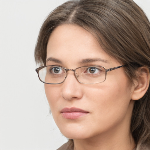 Neutral white adult female with long  brown hair and brown eyes