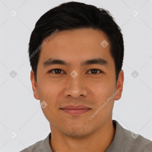 Joyful asian young-adult male with short  black hair and brown eyes