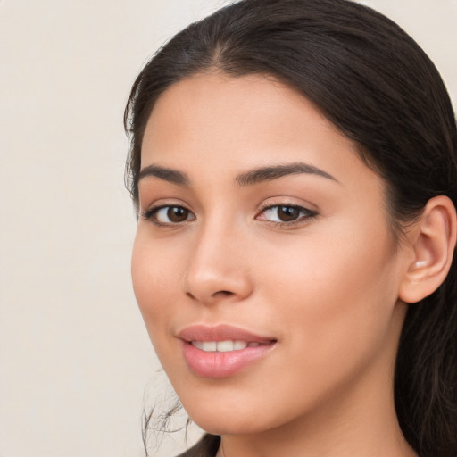 Joyful white young-adult female with long  brown hair and brown eyes