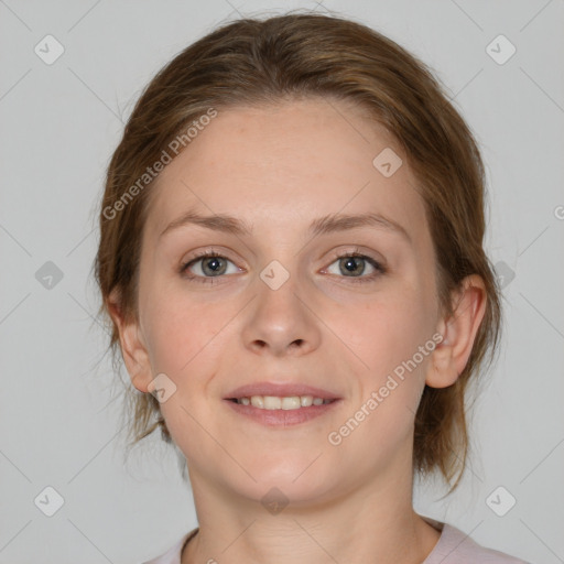 Joyful white young-adult female with medium  brown hair and grey eyes