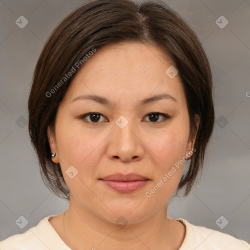 Joyful asian adult female with medium  brown hair and brown eyes