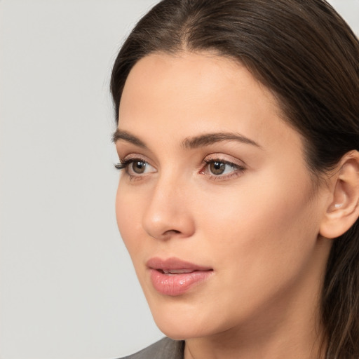 Neutral white young-adult female with medium  brown hair and brown eyes