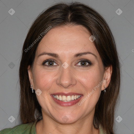 Joyful white adult female with medium  brown hair and brown eyes