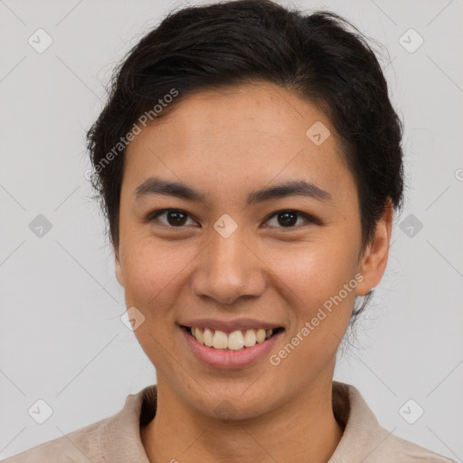 Joyful asian young-adult female with short  brown hair and brown eyes