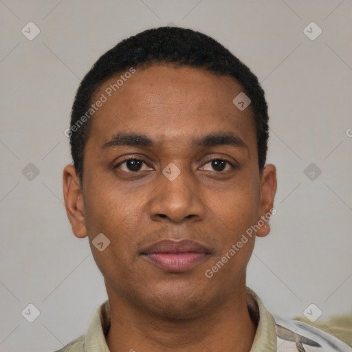 Joyful black young-adult male with short  black hair and brown eyes