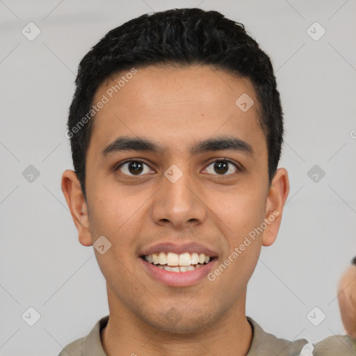 Joyful latino young-adult male with short  black hair and brown eyes