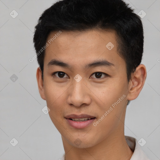 Joyful asian young-adult male with short  black hair and brown eyes