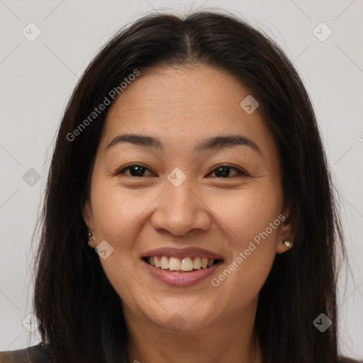 Joyful asian young-adult female with long  brown hair and brown eyes