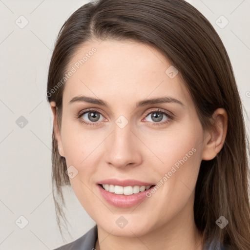 Joyful white young-adult female with medium  brown hair and grey eyes