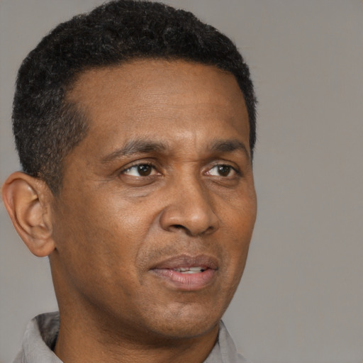 Neutral black adult male with short  brown hair and brown eyes