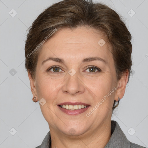 Joyful white adult female with short  brown hair and brown eyes