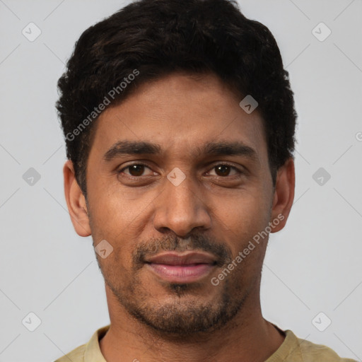 Joyful white young-adult male with short  black hair and brown eyes