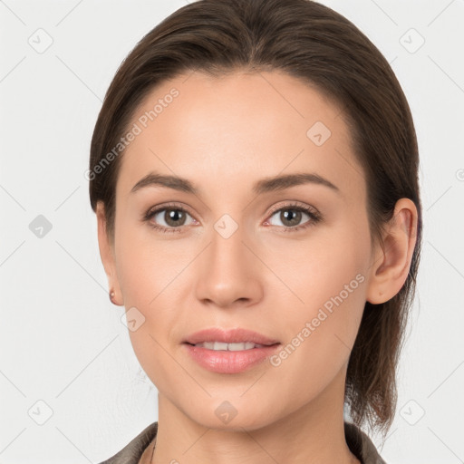 Joyful white young-adult female with medium  brown hair and grey eyes