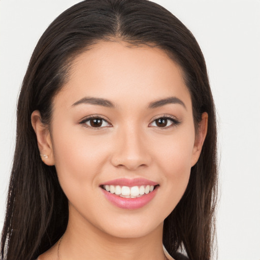 Joyful white young-adult female with long  brown hair and brown eyes