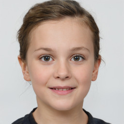 Joyful white child female with short  brown hair and brown eyes