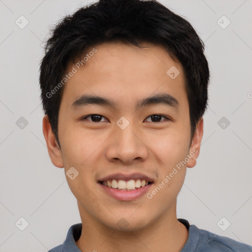 Joyful asian young-adult male with short  black hair and brown eyes