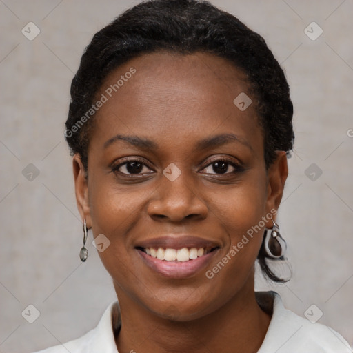 Joyful black young-adult female with short  black hair and brown eyes